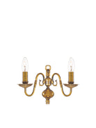 Classic brass two-light wall sconce with candle-style bulbs for ambient lighting.