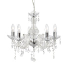 A clear glass chandelier with five unlit candle-style bulbs and dangling crystal accents.