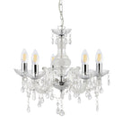 A clear glass chandelier with five lit candle-style bulbs and dangling crystal accents.