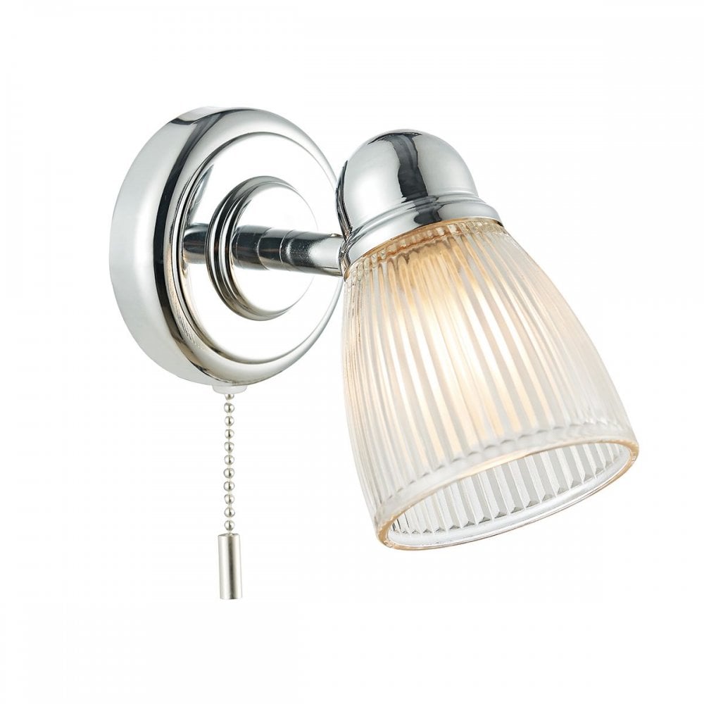 A close up of a lit, chrome and clear ribbed glass wall light on a white background.