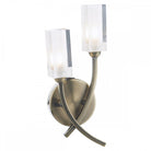 Two clear rectangular shades on a curved antique brass wall light.