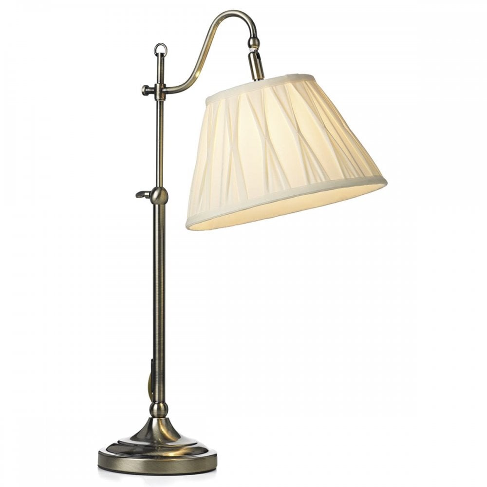 Adjustable antique brass table lamp with a cream pleated shade.