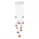A modern 12-light multi-pendant chandelier featuring iridescent glass spheres hanging at various lengths.