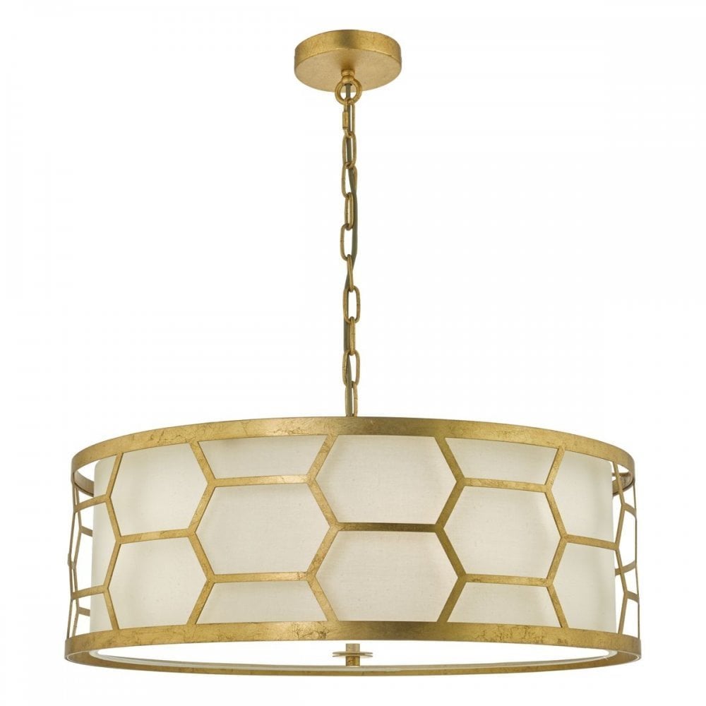 A round, gold chandelier with a honeycomb pattern and white diffuser.