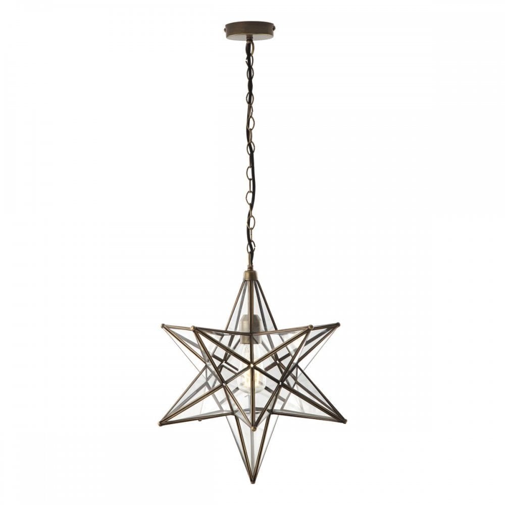 A star-shaped pendant light with a clear glass and brass frame, hanging from a chain.