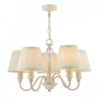 A 5-light cream chandelier with pleated shades on a white background.