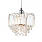 Brightly lit tiered crystal pendant light with chrome finish on a white background.