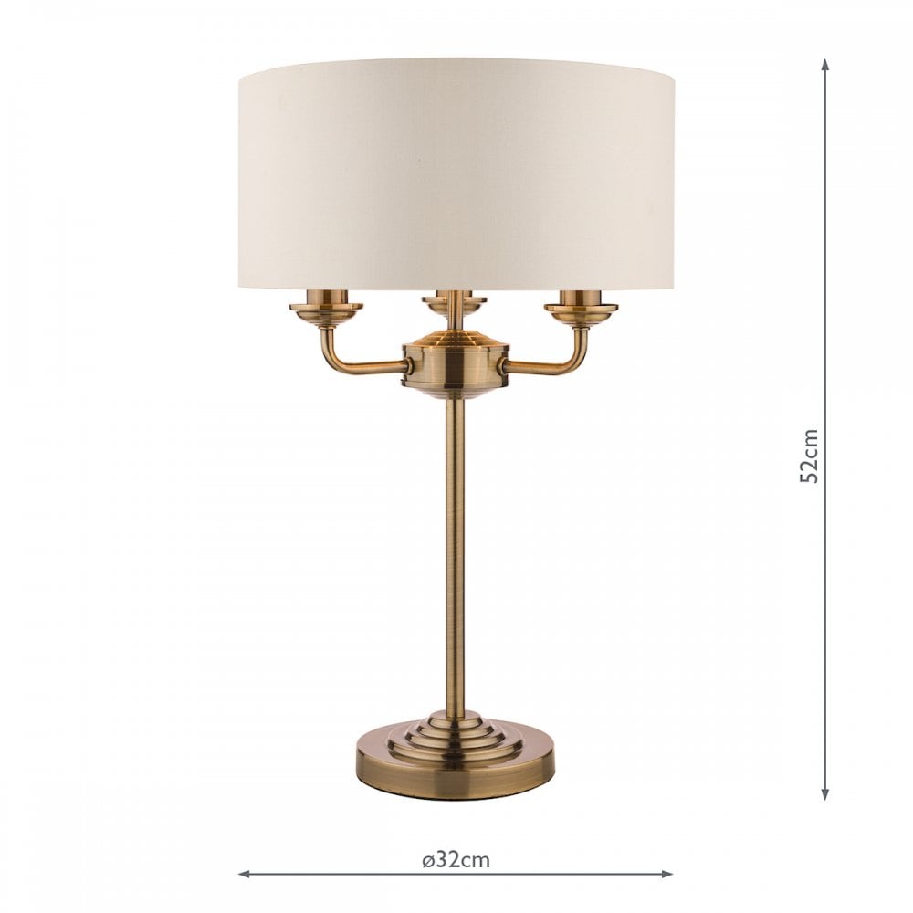 Brass table lamp with white shade and dimensions of 52cm height and 32cm diameter.