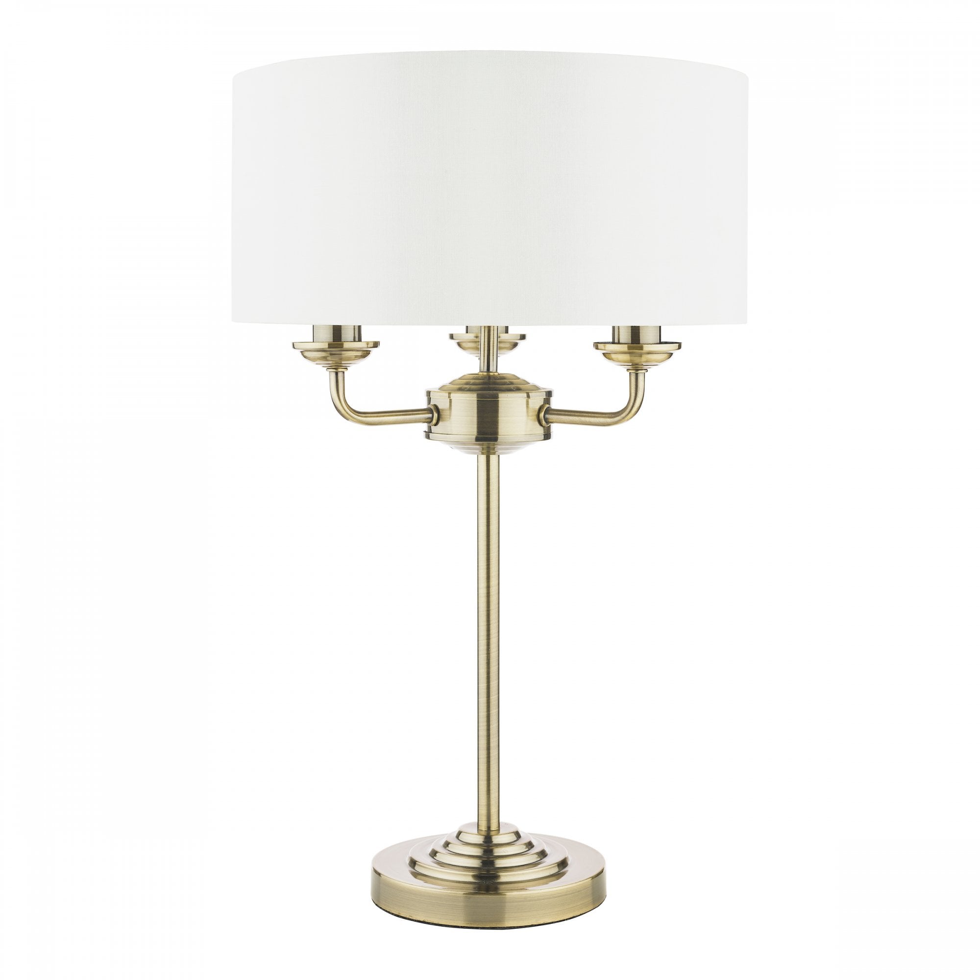 Elegant brass table lamp featuring a white fabric drum shade, ideal for ambient lighting.