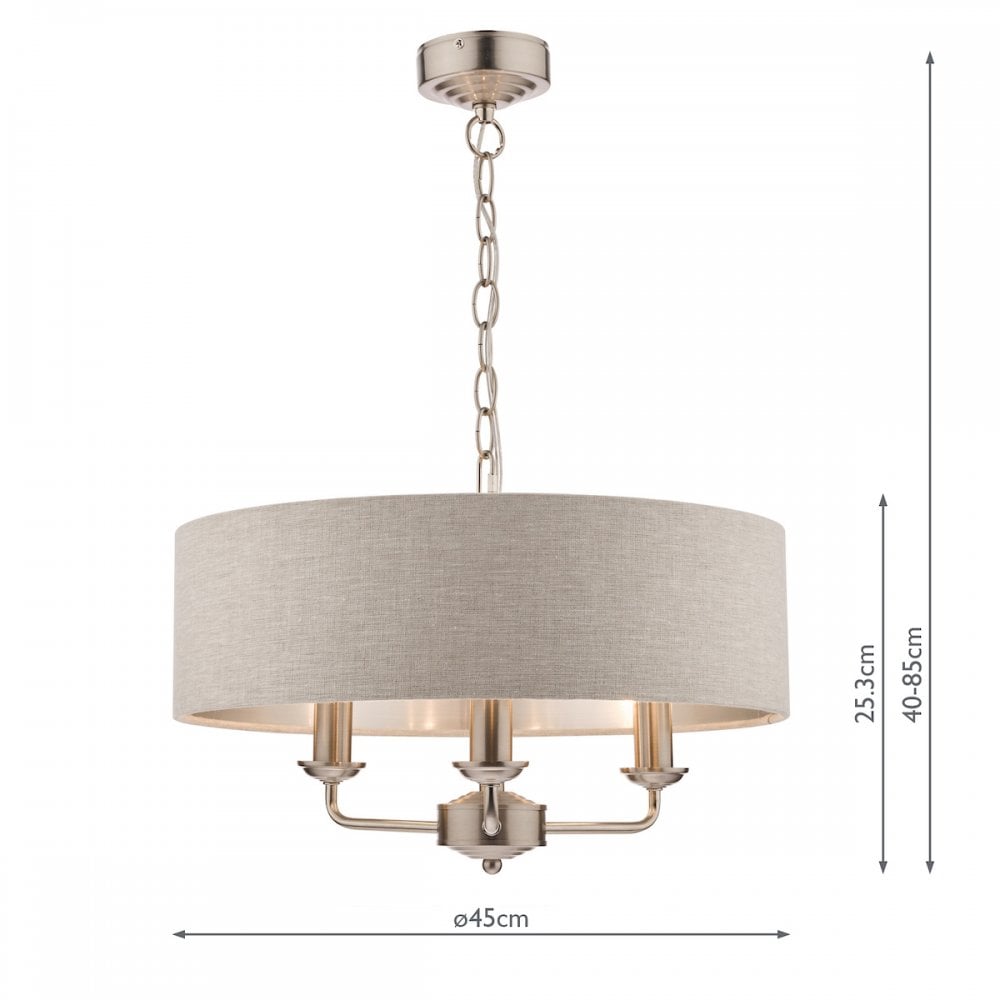 A cream drum shade chandelier with three candle-style lights shown with dimensions.