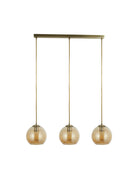 Three amber glass globe pendant lights suspended from a brass bar on a white background.