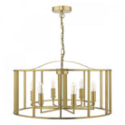 A brass chandelier with six exposed bulbs, encased in a stylish cylindrical cage design.