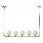 A modern chrome ceiling light with five white globe shades, perfect for contemporary homes.