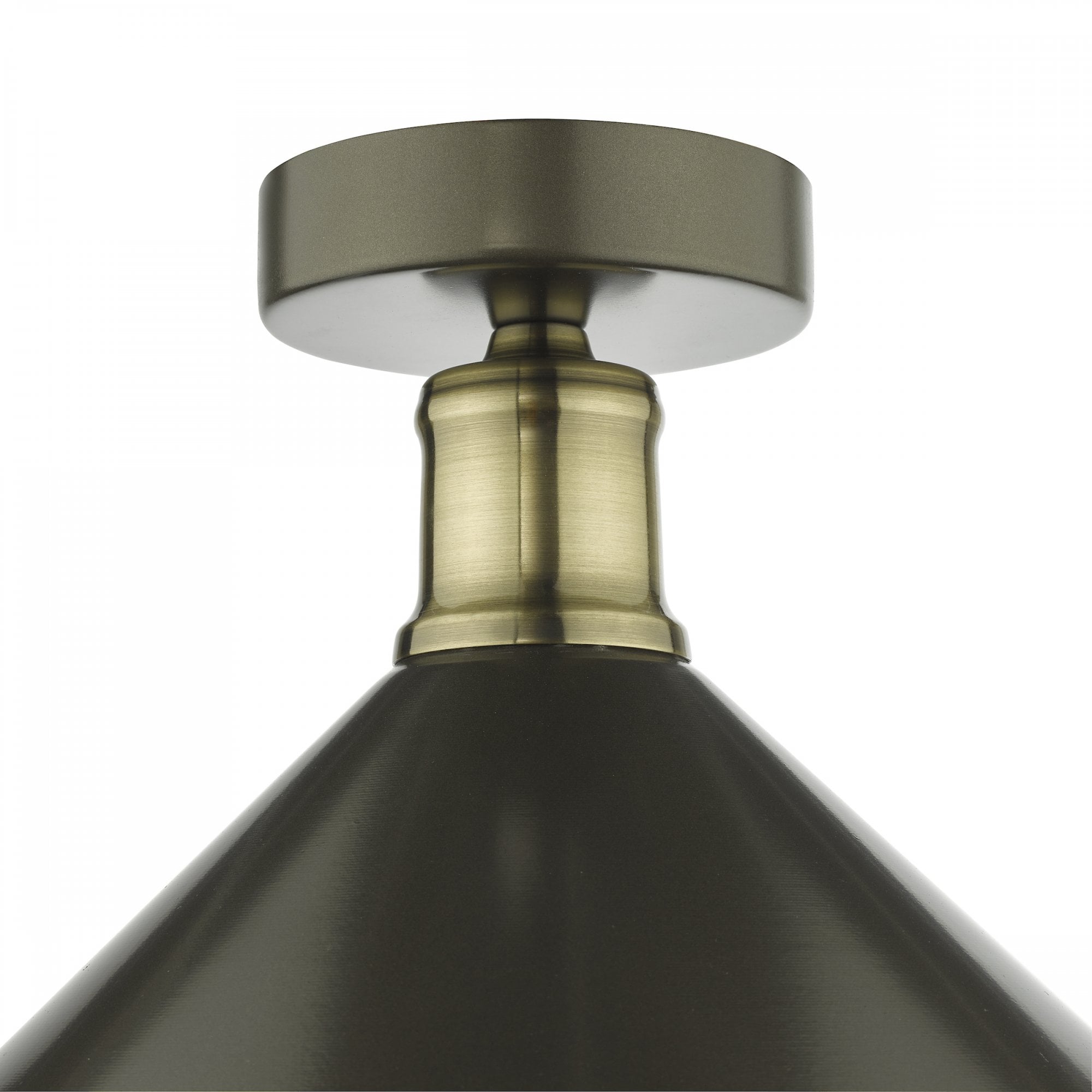 Close-up of the brass and black flush mount ceiling light fixture.