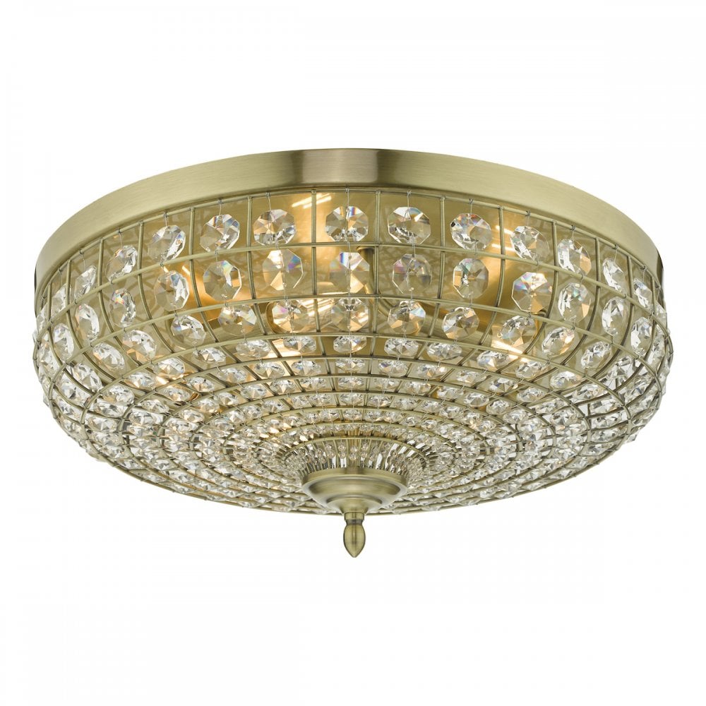 An ornate crystal-encrusted ceiling light with a gold base.