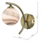 A brass wall light with a marbled globe shade, showing its dimensions.