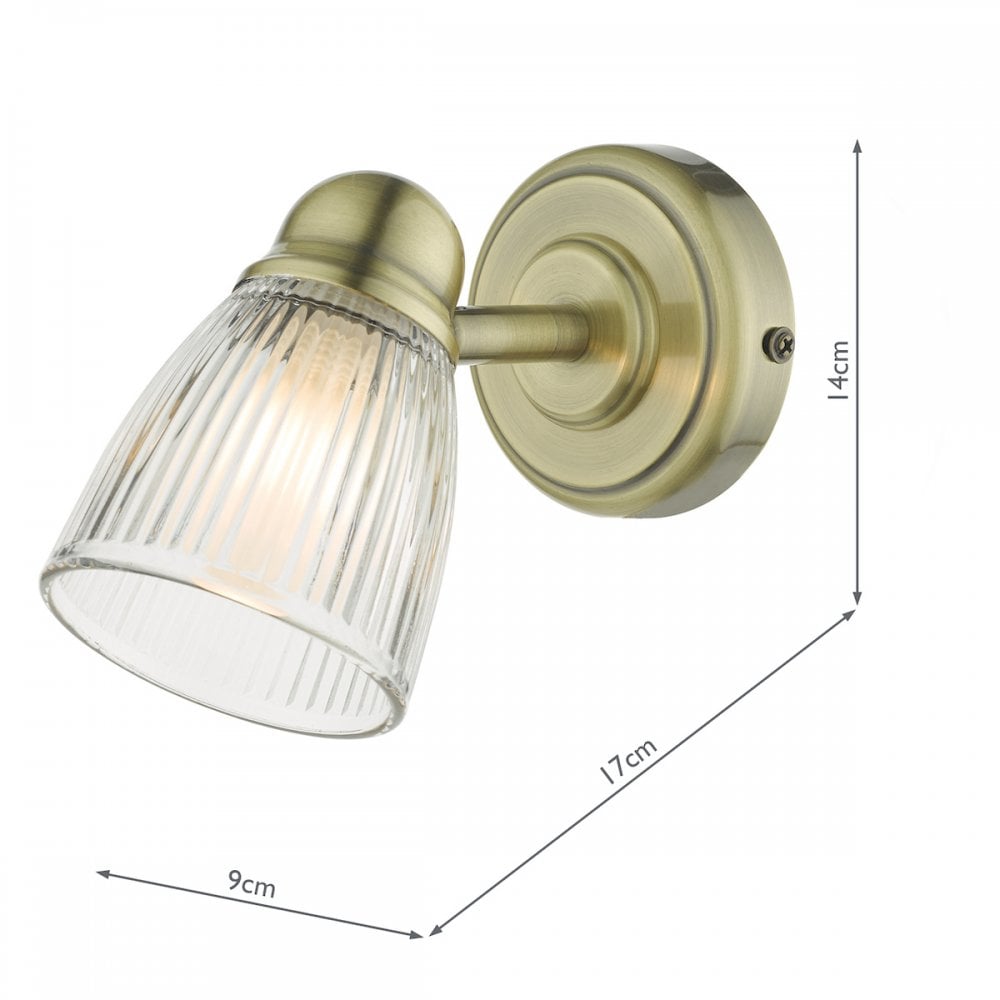 A brass wall light with a fluted glass shade, shown with its dimensions.