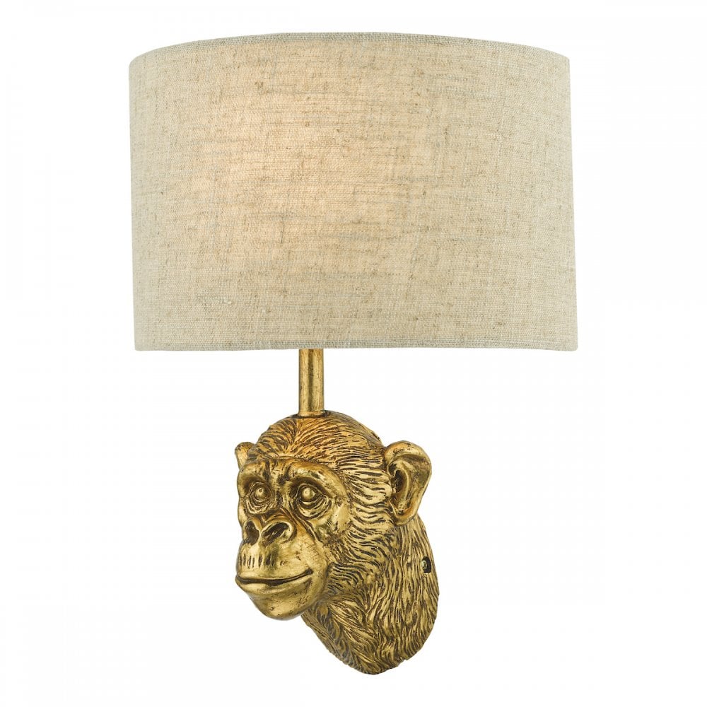 Elegant golden monkey head wall light with a linen shade.