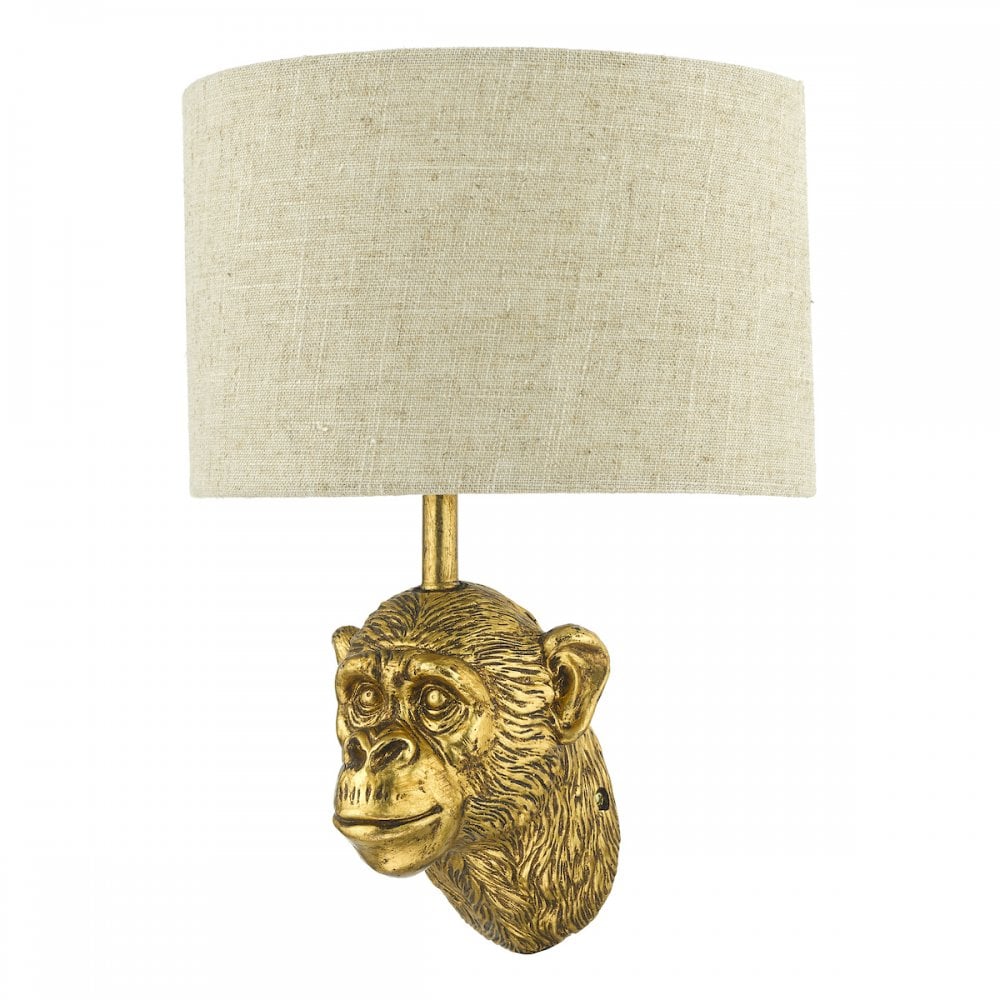 Elegant golden monkey head wall light with a linen shade.