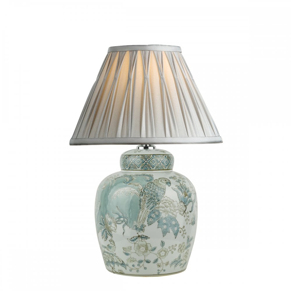 A decorative ginger jar lamp base with a blue pleated lamp shade.