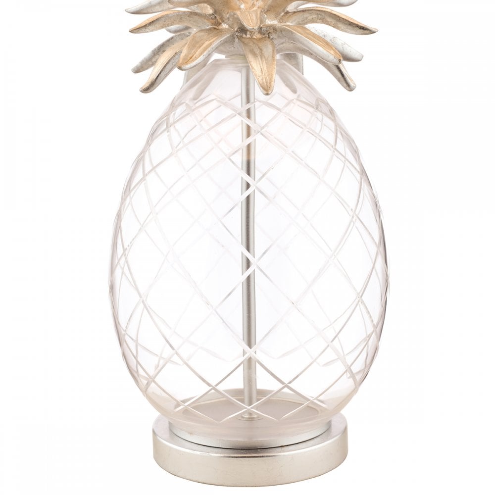 Close-up of the textured clear glass base of a pineapple-shaped table lamp.