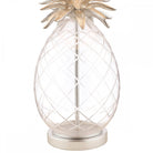 Close-up of the textured clear glass base of a pineapple-shaped table lamp.