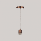 Close-up of a copper-colored pendant light fixture with a white cord and bulb holder.