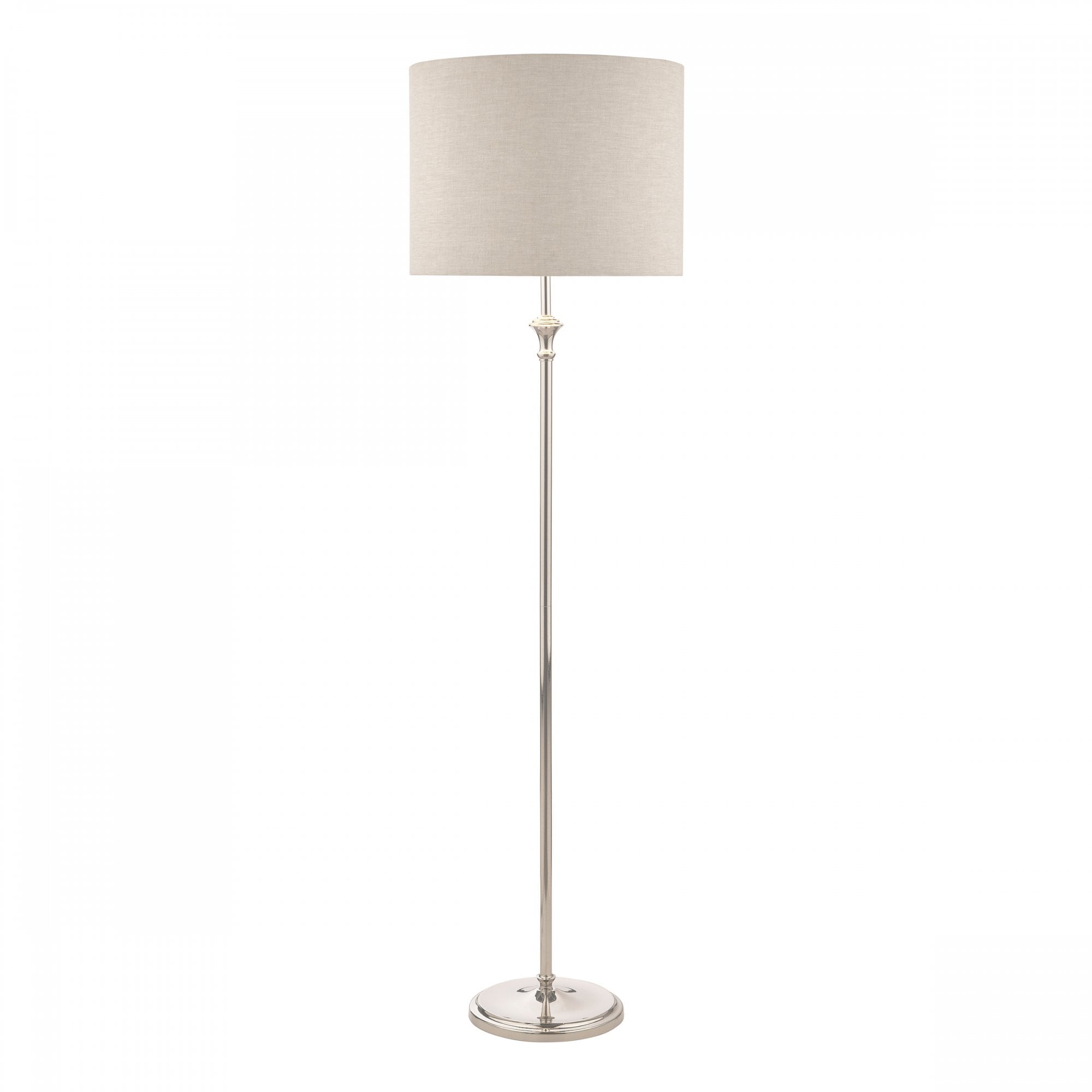 A tall, elegant floor lamp with a cream fabric shade and a polished silver base.