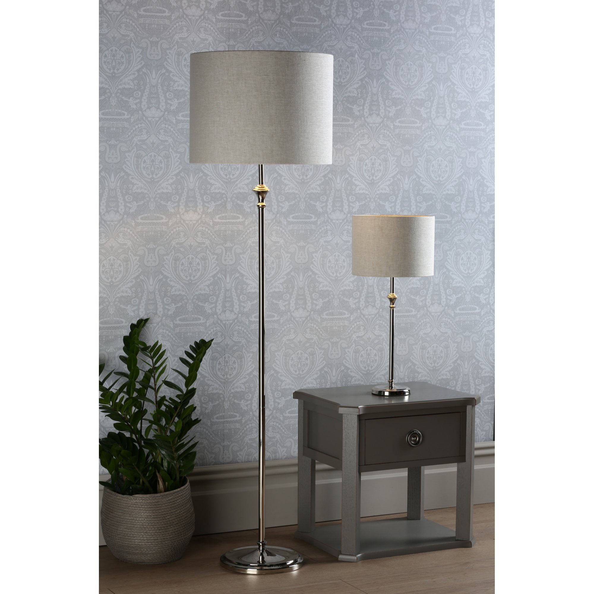 A matching floor lamp and table lamp set, providing ambient lighting in a living space.