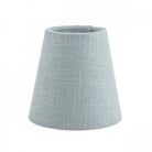 A small light blue fabric lamp shade with a subtle texture, suitable for small lamps.
