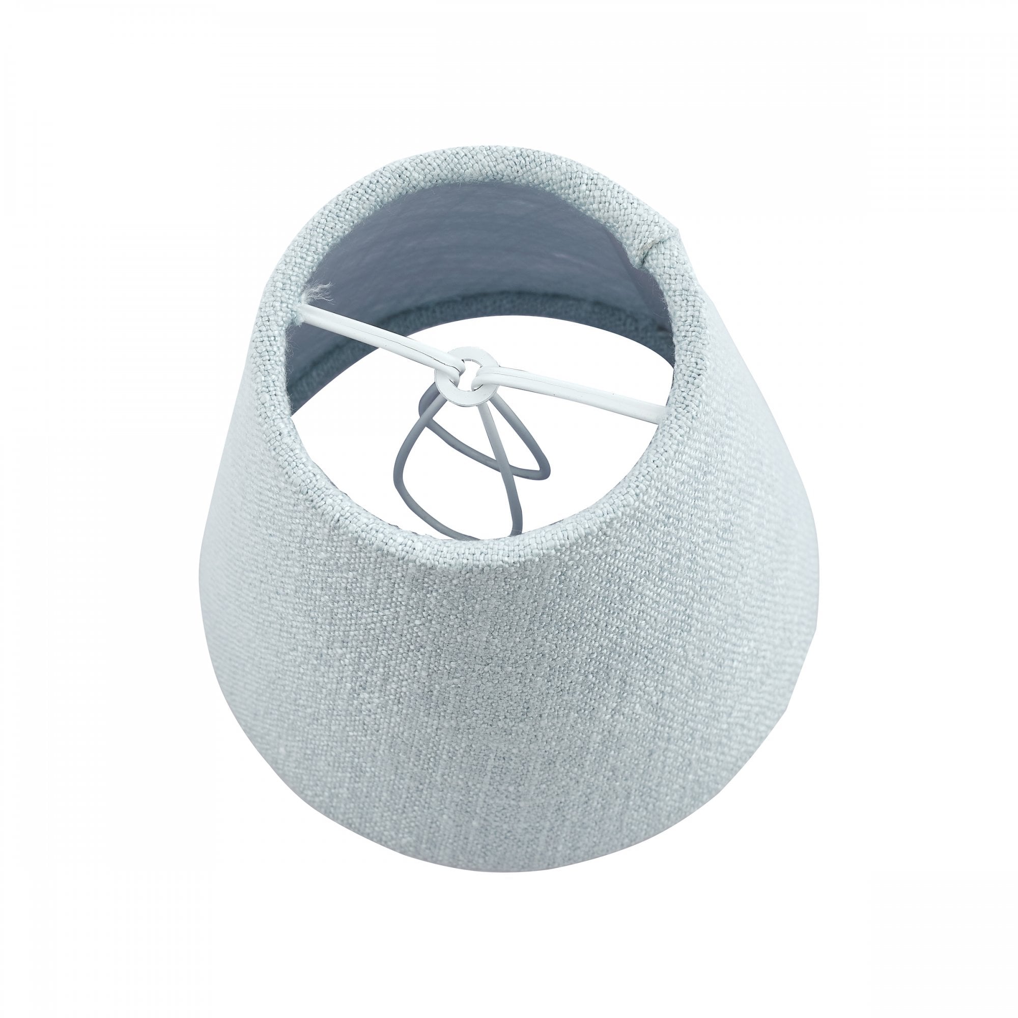 The interior of a small light blue fabric lamp shade, showing its wire frame.