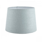 An extra-large light blue fabric lamp shade with a delicate texture, versatile for home decor.
