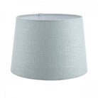 A grand light blue fabric lamp shade with a textured surface, ideal for floor lamps.