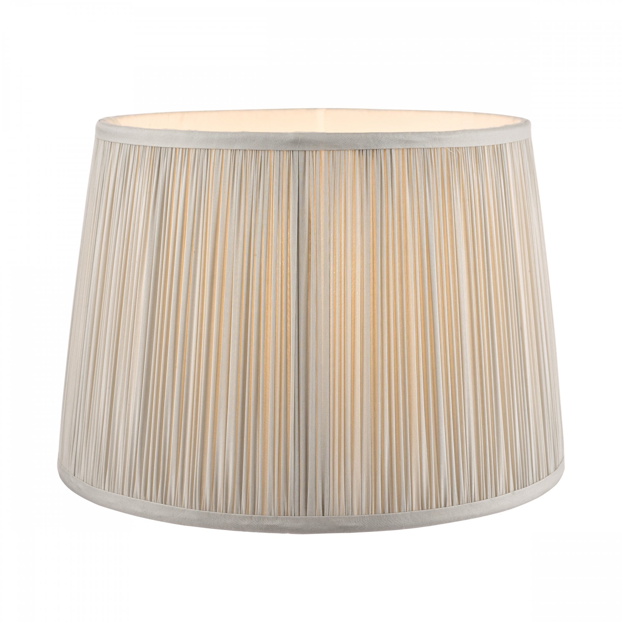 Pleated soft grey lamp shade with light on, showing the internal bulb glow.
