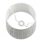 Top-down view of pleated soft grey lamp shade.