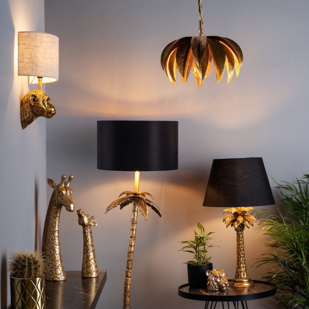 Eclectic room with monkey head wall light and palm tree themed lamps.