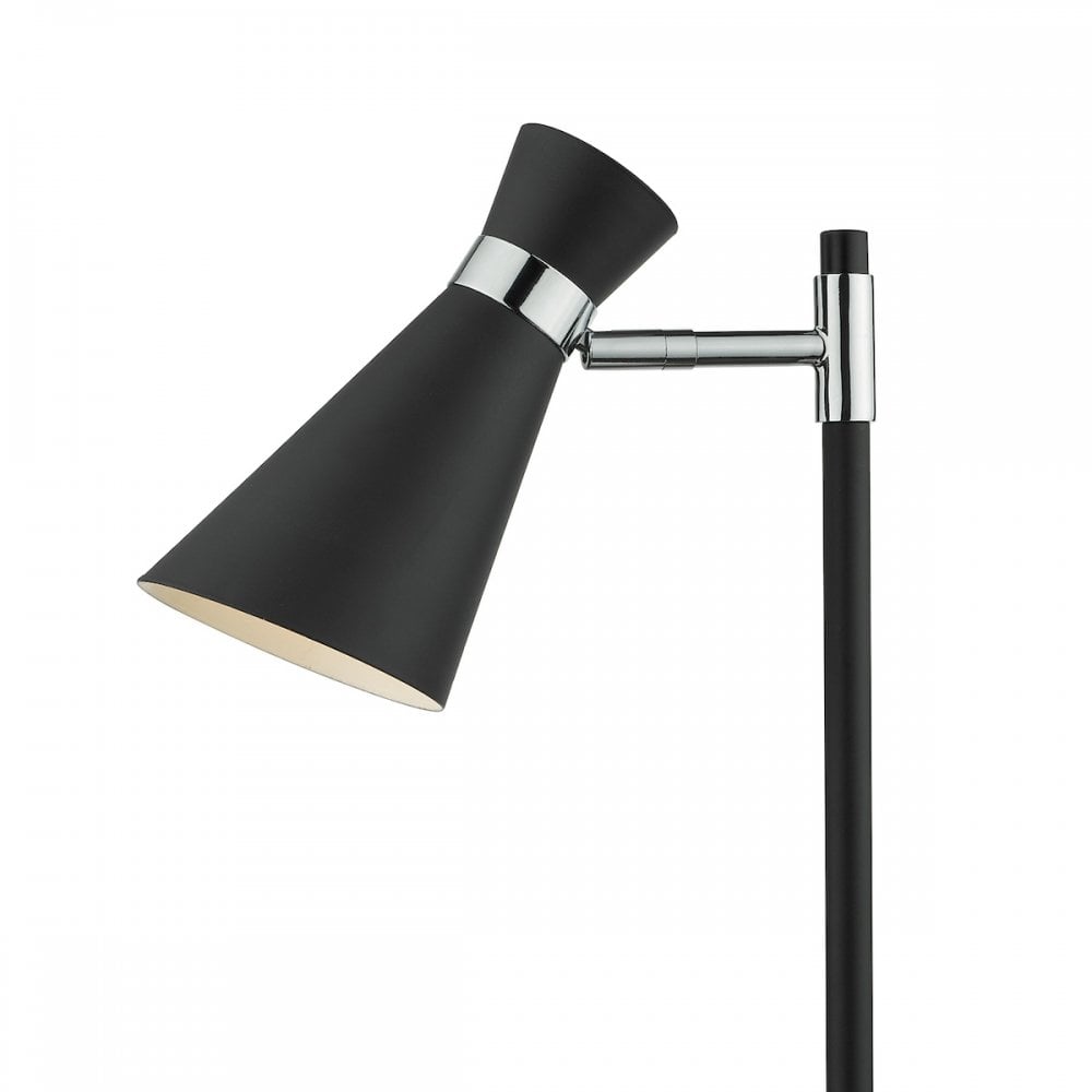 Close-up of the adjustable black cone-shaped shade and chrome accents of a table lamp.