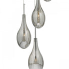 A detailed view of the textured, grey, teardrop-shaped glass of a contemporary chandelier.