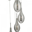 Close-up of the grey, ribbed, teardrop-shaped glass shades of a pendant light fixture.