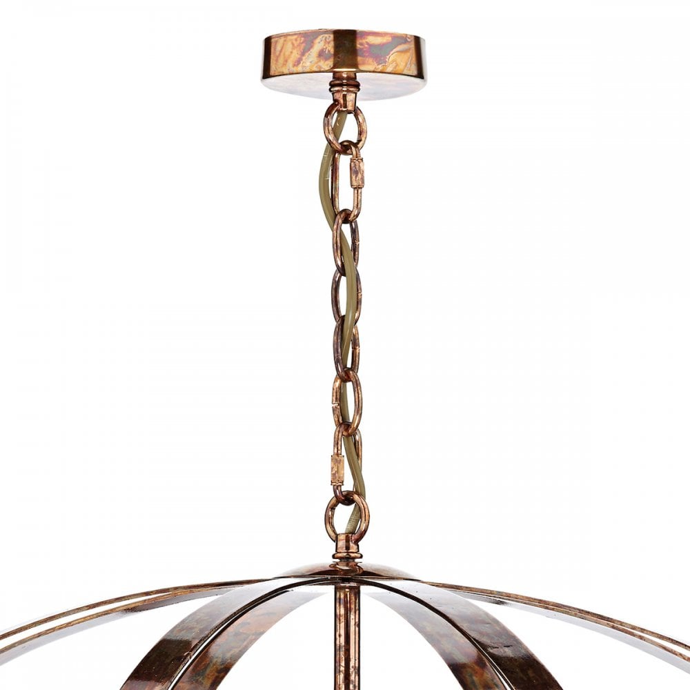 Close-up of the chandelier's ceiling rose and chain, showcasing its antique finish.