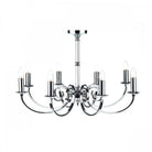 A silver chandelier with eight curved arms, each supporting an upward-facing candle bulb.