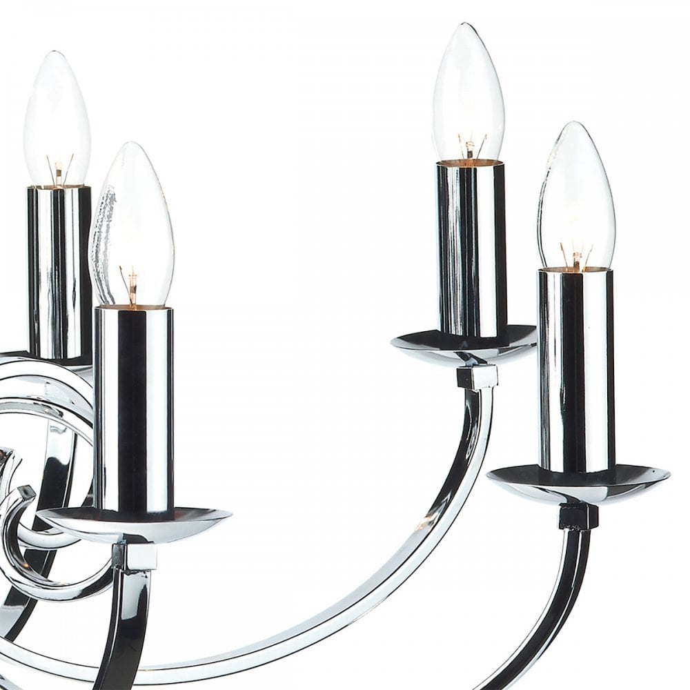 Close-up of three candle-shaped bulbs on the curved arms of a silver chandelier.