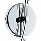 Close-up of the chrome circular base of the wall sconce, showing the arm attachment.