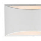 A close-up of the white, curved wall light with light shining from both top and bottom openings.