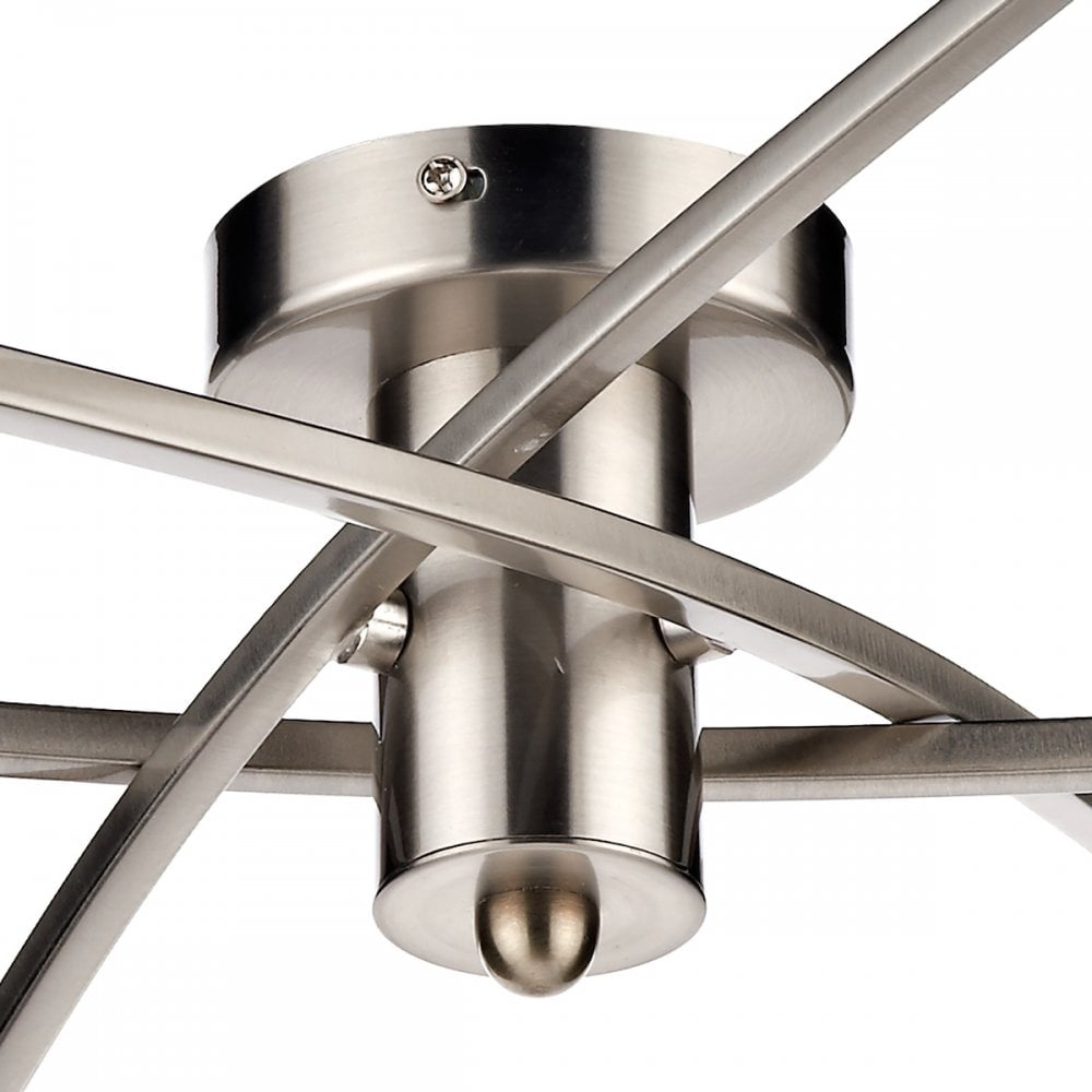 Detailed view of the central chrome fitting and crossed arms of the ceiling light.