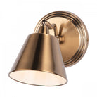 A close-up view of the adjustable wall light. The light is on and facing downwards.