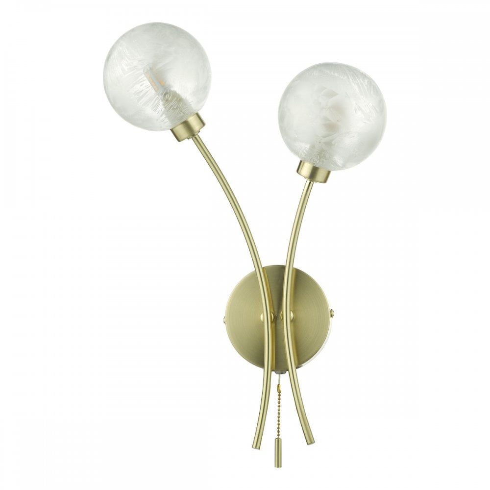 A modern double wall light with two clear glass orb shades and a brass base.