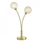 A modern two-bulb table lamp with spherical shades and a brushed brass finish.