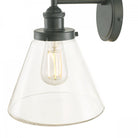 Close-up of the vintage outdoor wall light with a black fixture and clear glass shade.