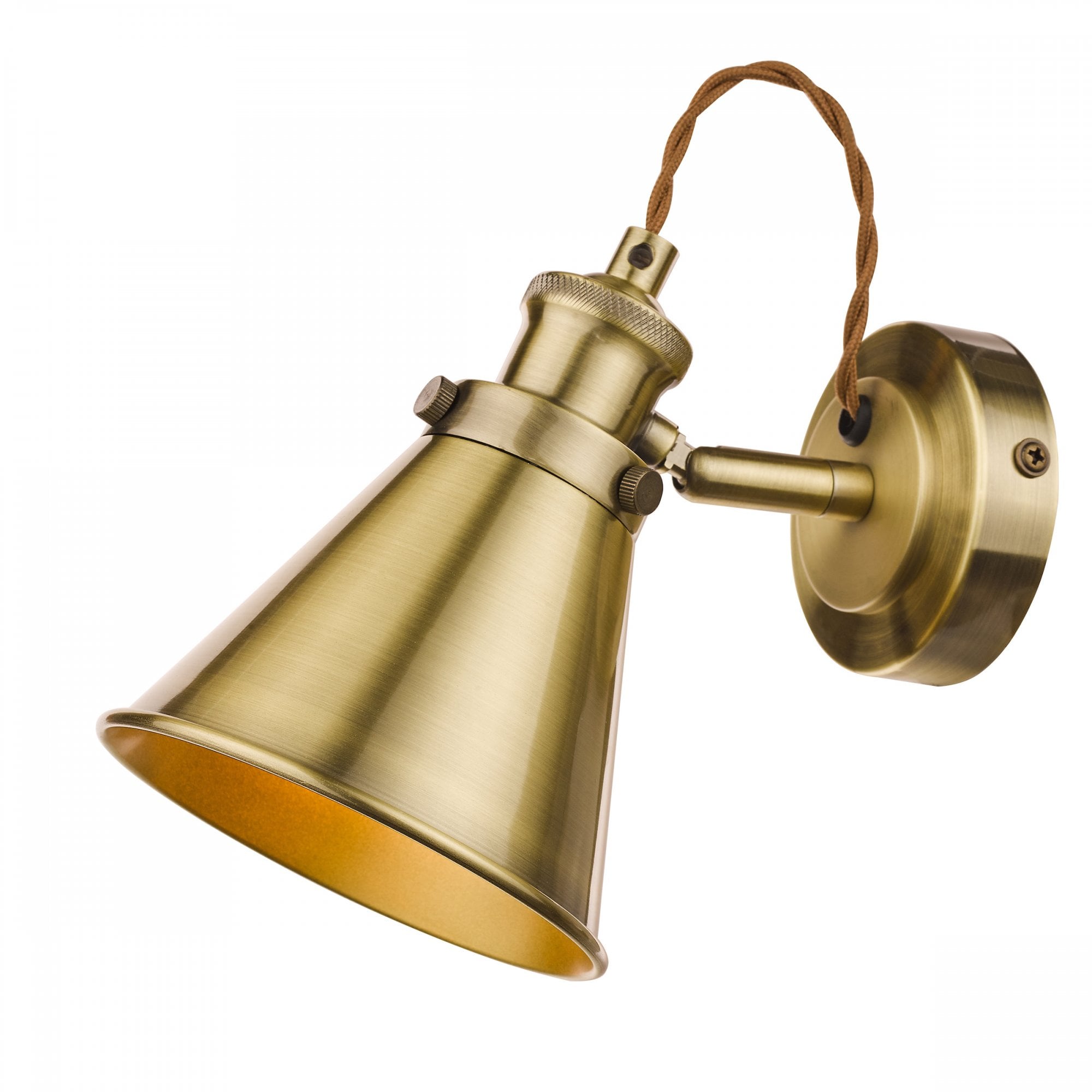 An industrial brass cone wall light with a braided cable on a white background.